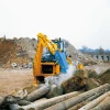 Venieri 10.23E utilizando un implemento especial para romper concreto en una obra.